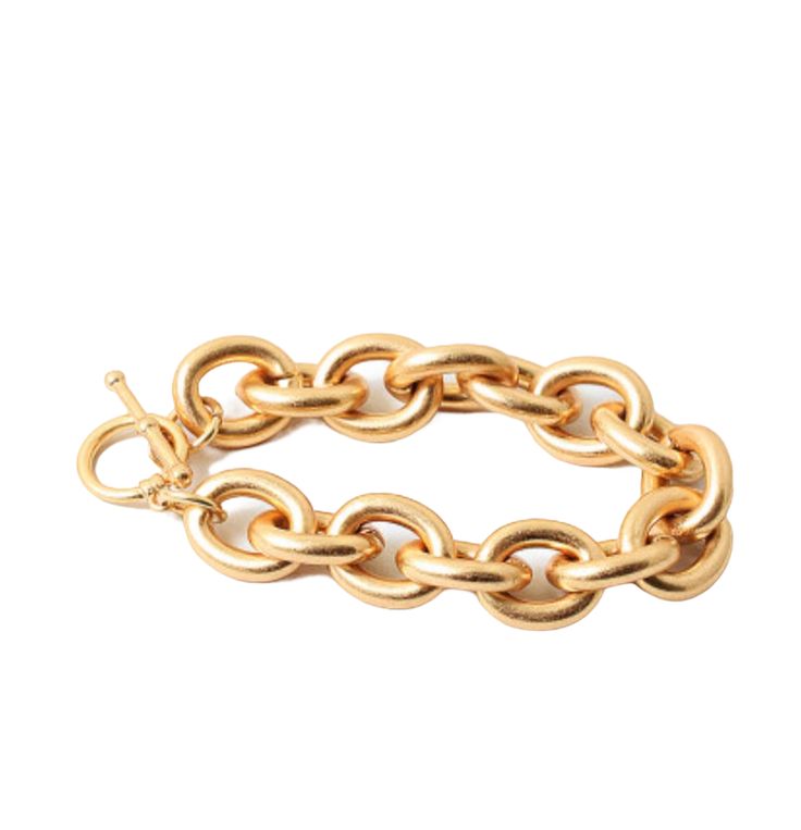 Introducing a timeless piece that merges traditional elegance with a contemporary flair: the Oversized Classic Gold Link Bracelet. Crafted to perfection, this bracelet is a true embodiment of sophistication and fashion-forward innovation. Its oversized design captures attention while the intricate details and modern twist set it apart from the ordinary. .66" width 6 3/4" legnth- need a different length? Contact us Chic Gold-tone Metal Bangle, Luxury Metal Bracelet With Chunky Chain, Bold Metal Bracelets For Gift, Timeless Gold-tone Metal Bracelets, Timeless Gold-tone Metal Bracelet, Chic Gold Metal Bangle Bracelet, Bold Adjustable Gold Jewelry, Chic Metal Bangle Chain Bracelet, Chic Metal Chain Bracelet