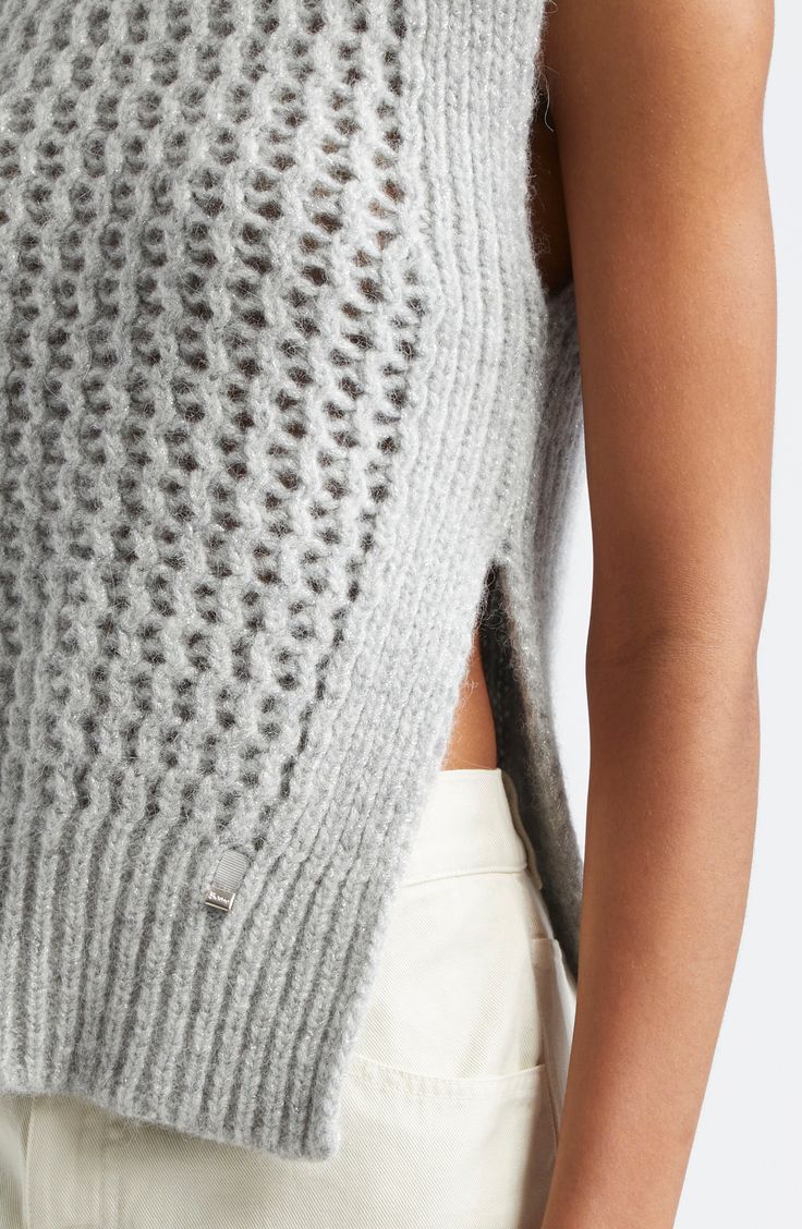 The Italian label's signature blend of relaxation and luxury shines in this alpaca-kissed sweater-tank boasting ribbed edges and an ornate openwork body. Mock neck Side slits 48% alpaca, 23% metallic fibers, 21% polyamide, 8% wool with 55% cotton, 45% polyester contrast Dry clean or machine wash, dry flat Made in Moldova Designer Clothing Chic Open Knit Sweater Vest For Fall, Chic Open Knit Sweater Vest, Chic Pointelle Knit Vest, Chic Open Knit Vest, Elegant Knit Vest For Layering, Chic Sleeveless Pointelle Knit Sweater, Elegant Sleeveless Knit Sweater, Winter Sleeveless Pointelle Knit Sweater Vest, Fine Knit Mohair Tops