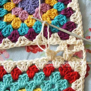 the crochet granny square is being worked on