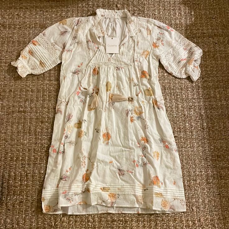 Nwt Gysette Dress. Purchased From A Local Boutique, But Decided It’s Not For Me. Cream With Elegant Floral Pattern. Orange Accents. Super Cute Belted Or On Its Own And Can Be Easily Dressed Up Or Down. Size 4. Make An Offer If Interested And Thanks For Shopping! White Mini Dress For Fall Beach Outings, Vintage White Summer Mini Dress, Vintage White Mini Dress For Summer, Off White Mini Dress For Spring Daywear, Vintage White Mini Dress For Daywear, White Floral Print Mini Dress For Fall, White Vintage Mini Dress For Daywear, White Mini Dress For Fall Garden Party, Bohemian Short Sleeve Mini Dress For Daywear