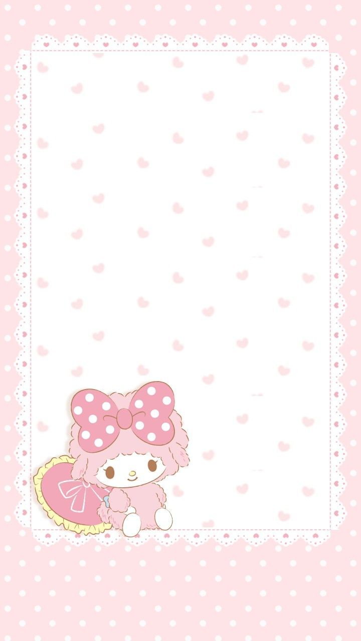 a pink hello kitty card with polka dots on the bottom and a white border around it