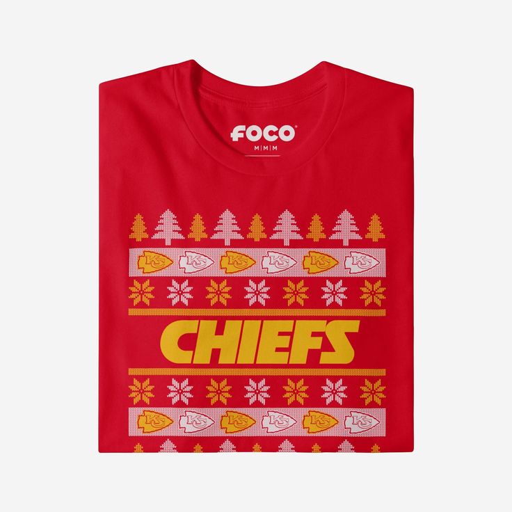 Holiday sweater or t-shirt? Holiday sweater? Or t-shirt? Holiday sweater AND t-shirt. The best of both worlds is the best way to combine your team spirit and holiday spirit. When you put on this Kansas City Chiefs Holiday Sweater T-Shirt, get ready to witness all your fellow fans at the office holiday party or family gathering bow to your festive fandom when they get a load of this one. This top features a design that showcases your all-important team colors and a bold team logo display across t Crew Neck Fan Apparel T-shirt, Fan Gear Graphic Print Crew T-shirt, Winter Fan Apparel Cotton T-shirt, Winter Cotton T-shirt For Fans, Fan Apparel Crew T-shirt For Sports Events, Winter Fan Apparel Tops With Team Name, White Tops With Team Logo For Winter, White Winter Tops With Team Logo, Team Spirit Fan Gear T-shirt With Crew Neck