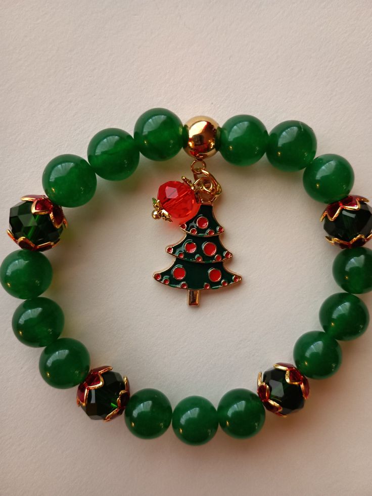 Christmas tree charm bracelet Cheap Holiday Bracelets With Round Beads, Christmas Beaded Bracelets Tutorial, Christmas Colors Jewelry, Affordable Silver Christmas Bracelets, Affordable Silver Christmas Bracelet, Cheap White Bracelets For Christmas, Disney Bead Bracelet December, Cheap Christmas Holiday Charm Bracelet, Christmas Teacher Bracelets