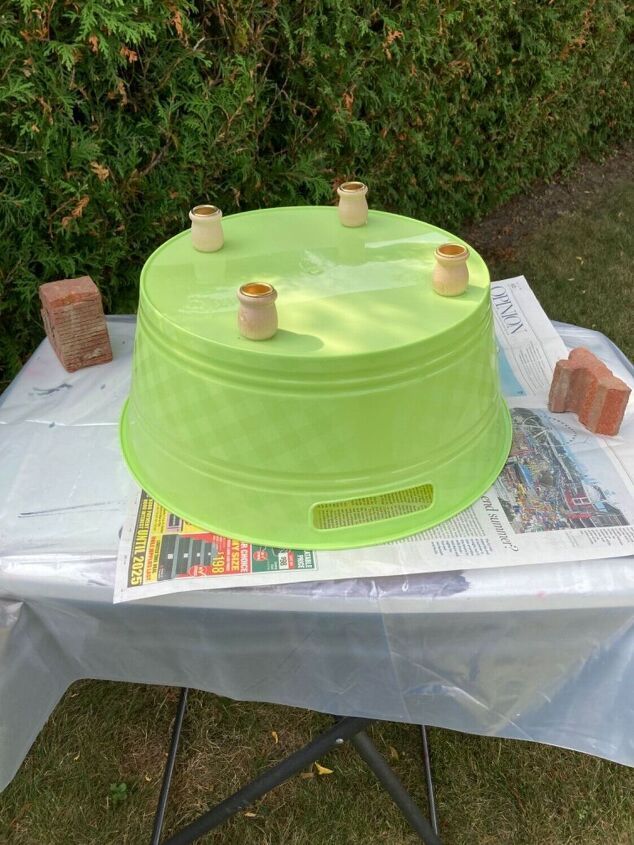 a green cake sitting on top of a table