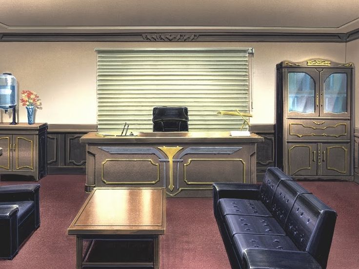 an office with leather couches and desks in front of a large screen tv