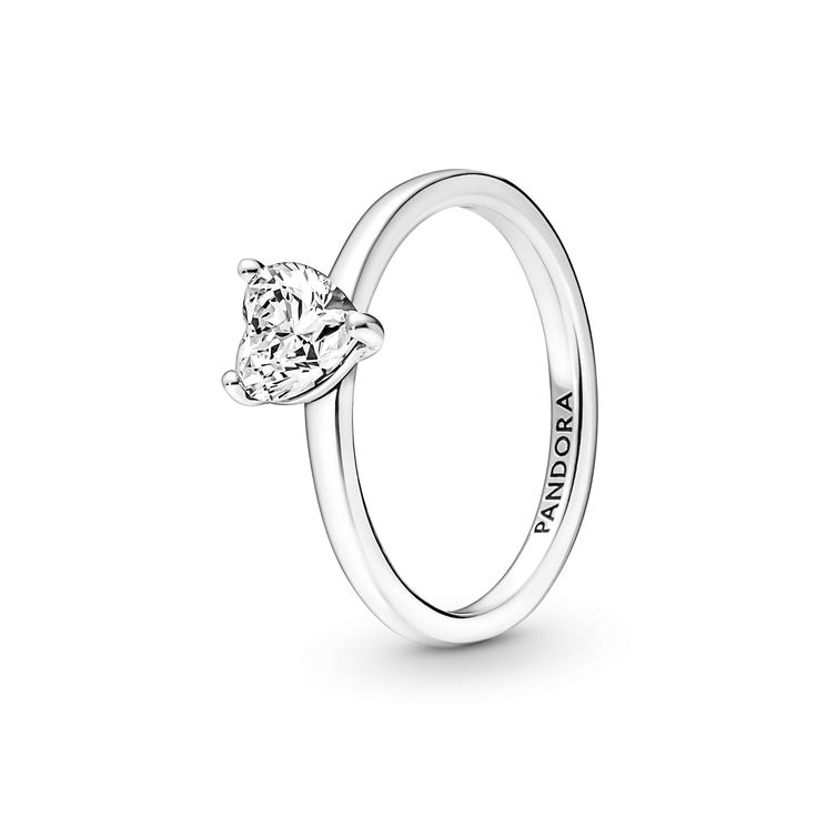 The latest addition to our solitaire collection, the Sparkling Heart Solitaire Ring features a heart-shaped clear cubic zirconia as the centerpiece. The Pandora logo is engraved on the inside of the polished shank. Stack this ring with other sterling silver pieces for a monochromatic look or mix metal finishes to make a unique statement.