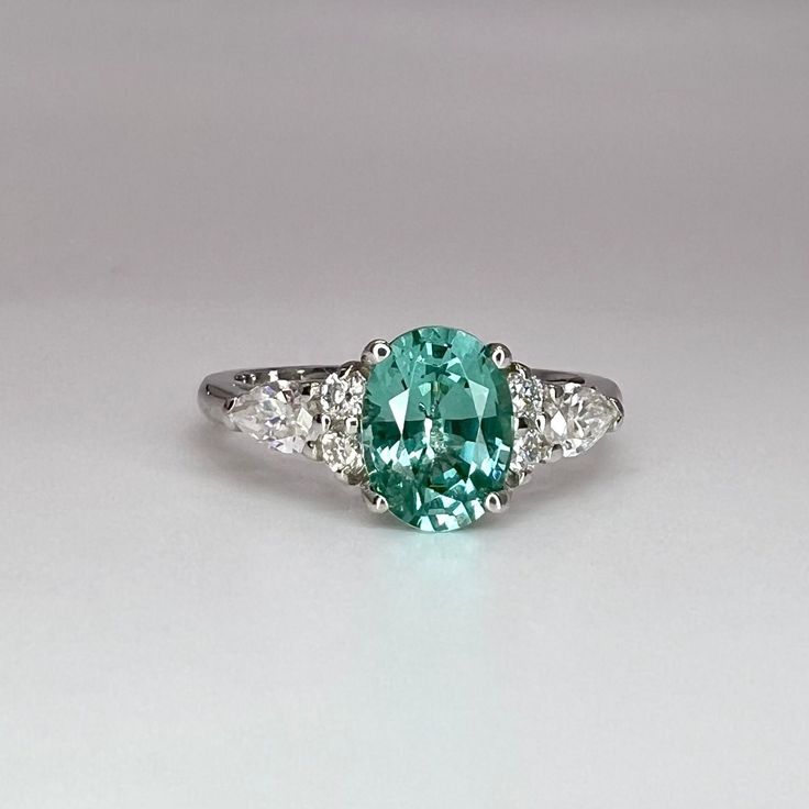 "This is a Paraiba tourmaline ring. The teal paraiba engagement ring is set in 14k solid gold. The  green tourmaline makes a great promise anniversary, wedding ring. This unique Vintage paraiba proposal ring is for women.  The ring pictured is lab created teal green paraiba with moissanite accents #7944 Also shown with ring #7207 - olive green saph. sold separately Also offered with lab grown diamond accent stones Use dropdown to make selection This ring can be made with many different stone col Tourmaline Wedding Ring, Paraiba Tourmaline Ring, Proposal Rings, Wedding Ring Vintage, Tourmaline Engagement Ring, Blue Engagement Ring, Cute Engagement Rings, Future Engagement Rings, Paraiba Tourmaline