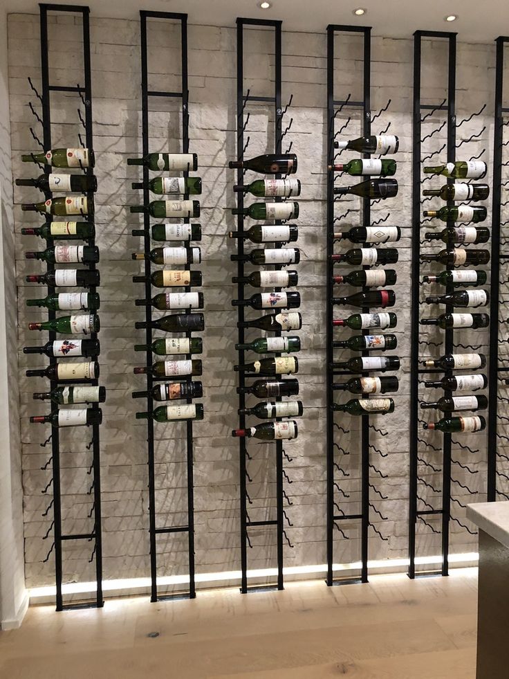 the wine rack is full of many bottles