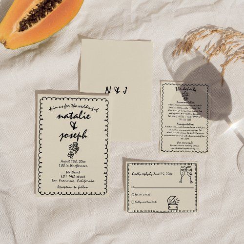 the wedding stationery is laid out on paper