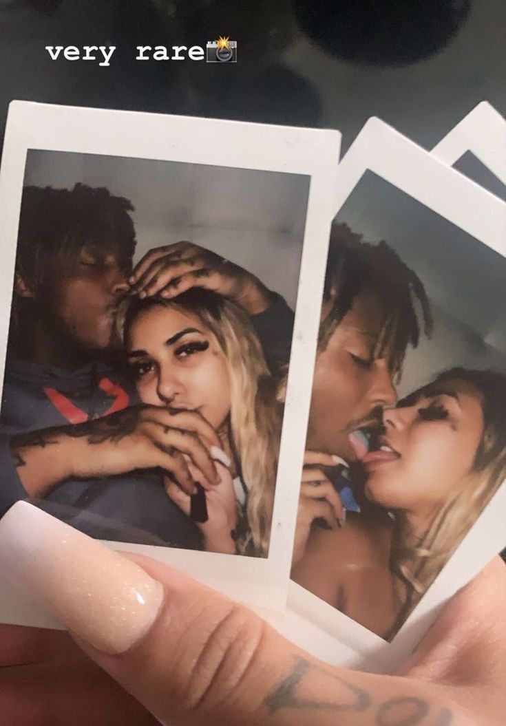 three polaroids in the palm of someone's hand with tattoos on them