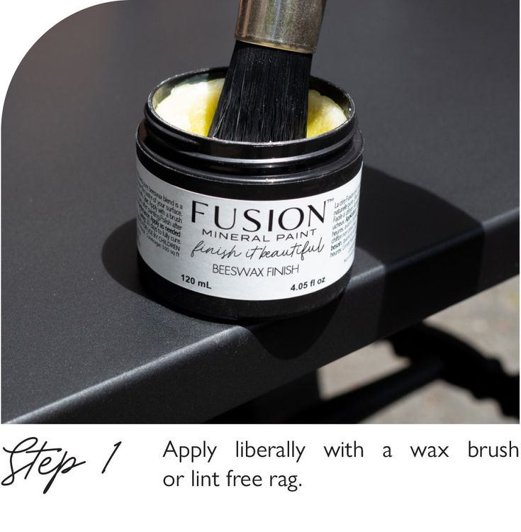 a brush is sitting on top of a black table with white writing and the words fusion apply liberily with a wax brush or lint free rag