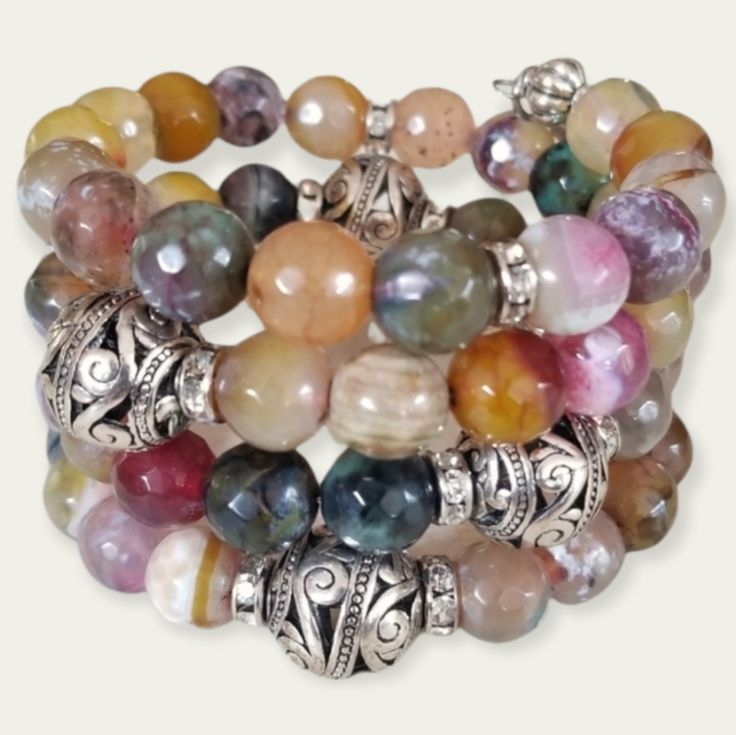 Memory Wire Wrap Bracelet Features A Colorful Mix Of Agate, Semi-Precious Stones, Rhinestone Rondelles And Decorative Silver Tone Beads. Finished With A Rhinestone Owl And Amethyst Rhinestone Charm On Each End. Details: Artisan Designed And Handcrafted. One Of A Kind. One Size Fits Most Size Wrists. Memory Wire Keeps Its Shape Forever. Simply Wrap Around Your Wrist. Please See Photos For Additional Details. Product Color May Differ Slightly From Photos. Smoke Free Home. Nwt Bundle Your Favorites Multicolor Agate Bracelets With Natural Stones, Multicolor Agate Bracelet With Natural Stones, Multicolor Agate Jewelry With Faceted Beads, Elegant Multicolor Agate Bracelets, Adjustable Agate Bracelet With Polished Beads, Multicolor Hand-strung Agate Jewelry, Adjustable Multicolor Agate Jewelry, Multicolor Agate Beaded Bracelets With Round Beads, Handmade Multicolor Agate Beaded Bracelets