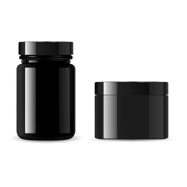 two black jars with lids are next to each other on a white background and one is empty