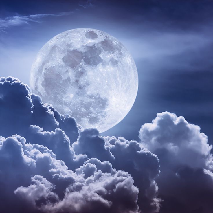 the full moon is in the sky with clouds