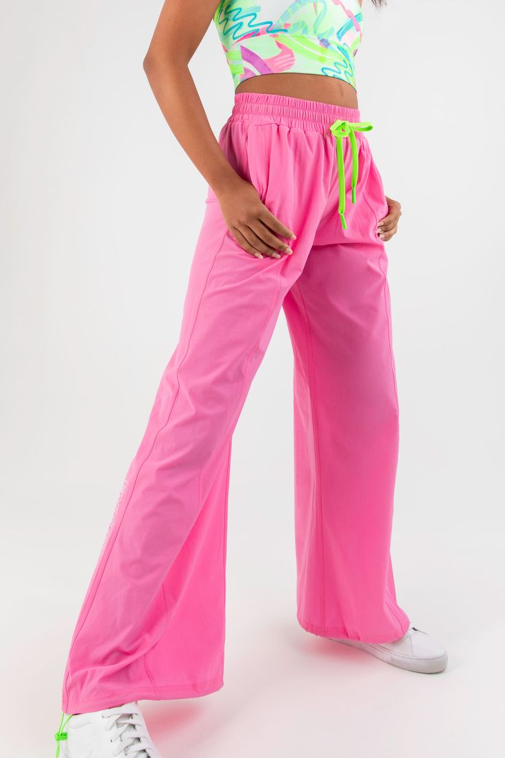 Shine brighter than a highlighter with the Highlighter Wide Leg Pant in Flower Pink. These are the pants that dreams are made of. These wide-leg pants allow you to express yourself in a bold new shape in this season’s hottest shade – barbie-core pink. Sporty Pink Straight Leg Pants, Pink Wide Leg Athleisure Sweatpants, Pink Wide Leg Sweatpants Athleisure Style, Pink Straight Leg Sweatpants For Spring, Sporty Spring Pants, Trendy Pink Straight Leg Sweatpants, Trendy Wide Leg Pink Sweatpants, Trendy Pink Wide Leg Sweatpants, Pink Wide-leg Parachute Pants For Spring