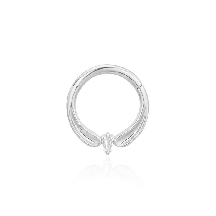 Indulge in elegance with the Honeymoon clicker. This luminous hinged ring features a small center Baguette CZ and a sleek, concave gold clicker design. Show off its subtle sparkle and smooth finish in a Septum or Daith piercing. (1) 1.5mm x 2.0mm Tapered Baguette CZ Solid 14K Yellow, Rose or White Gold Sold as a single Lifetime guarantee against any manufacturing defects 16G Ember orders are filled on average within 1-2 weeks. Please see our Shipping and Fulfillment page for more information. Elegant Small Hoop White Gold Rings, Elegant White Gold Hoop Septum Ring, Elegant Hoop Septum Ring For Everyday, Elegant Everyday Hoop Septum Ring, Elegant White Gold Huggie Rings, Elegant Everyday Septum Hoop Ring, Elegant Wedding Septum Ring, Elegant 14k Gold Septum Ring For Anniversary, Elegant Small Hoop Septum Ring