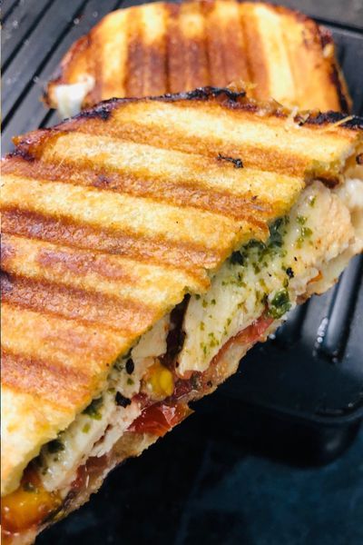 a grilled sandwich is sitting on the grill