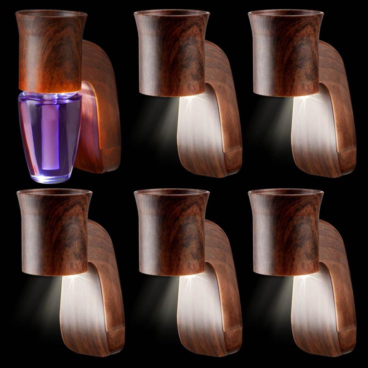 six wooden vases are arranged in the shape of curved shapes, each with a purple liquid inside