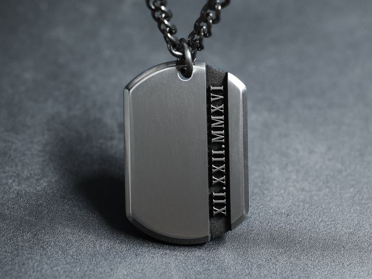 "Elevate your style with our modern Titanium Roman Numeral necklace - a perfect blend of uniqueness and personal significance. Choose your own set of Roman Numerals to symbolize special dates like weddings, anniversaries, graduations, recoveries, or important birthdates. This subtle yet meaningful custom necklace is a great personal gift that not only looks handsome but holds a reminder of a cherished memory. Choose a special date and convert it into Roman Numerals using the website below : www. Customizable Silver Necklaces, Silver Necklaces For Father's Day Memorial, Customizable Silver Necklace For Father's Day, Engraved Gunmetal Stainless Steel Jewelry, Customizable Silver Jewelry For Father's Day, Engraved Gunmetal Necklace For Gift, Modern Stainless Steel Necklace For Anniversary, Gunmetal Jewelry With Polished Finish As Gift, Gunmetal Jewelry With Polished Finish For Gift