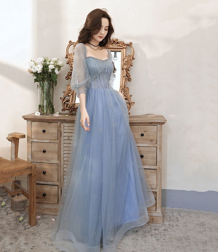 Prom Dress Cute Simple, Pale Blue Tulle Dress, Flowy Blue Dress Long, Half Sleeve Prom Dress, Longsleeve Fairy Dress, Light Blue Prom Dress Sleeves, Pale Blue Ball Gown, Light Blue Prom Dress Long Sleeve, Light Blue Prom Dress With Sleeves