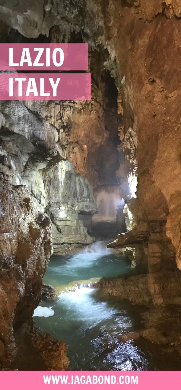 the inside of a cave with blue water in it and text overlay that reads lazio