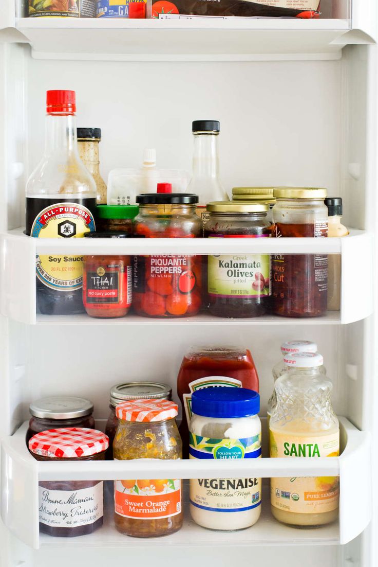 an open refrigerator filled with food and condiments