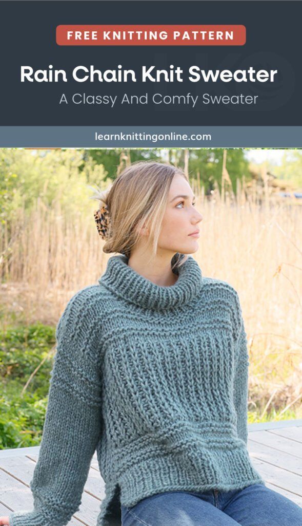 a woman sitting on top of a wooden bench wearing a green knit sweater and jeans