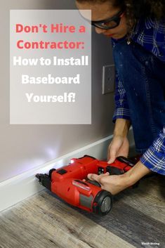 a man is fixing a baseboard with a drill and screwdriver on the floor