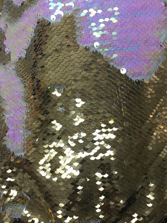 Mermaid flip up sequin shiny iridescent pink on one side and shiny gold at the other side on stretch Glamorous Gold Sequin Fabric With Glitter Print, Gold Sequin Fabric With Glitter Print For Glamorous Looks, Glamorous Iridescent Sequin Fabric With Shimmer, Glamorous Iridescent Shimmer Sequin Fabric, Glamorous Iridescent Shimmering Sequin Fabric, Festive Gold Sequin Fabric, Glamorous Metallic Shiny Sequin Fabric, Glamorous Metallic Sequin Fabric, Glamorous Gold Sequin Fabric With Shimmer