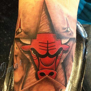 a man with a bulls tattoo on his arm