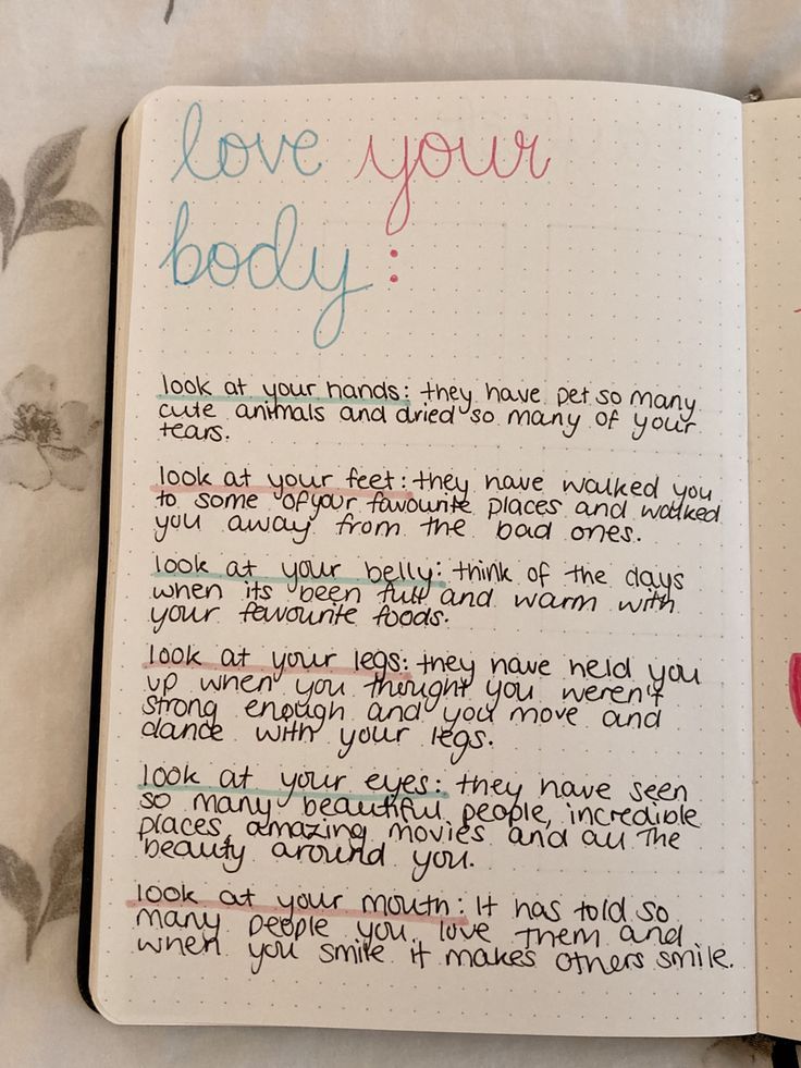 an open notebook with writing on it that says love your body and the words i love you