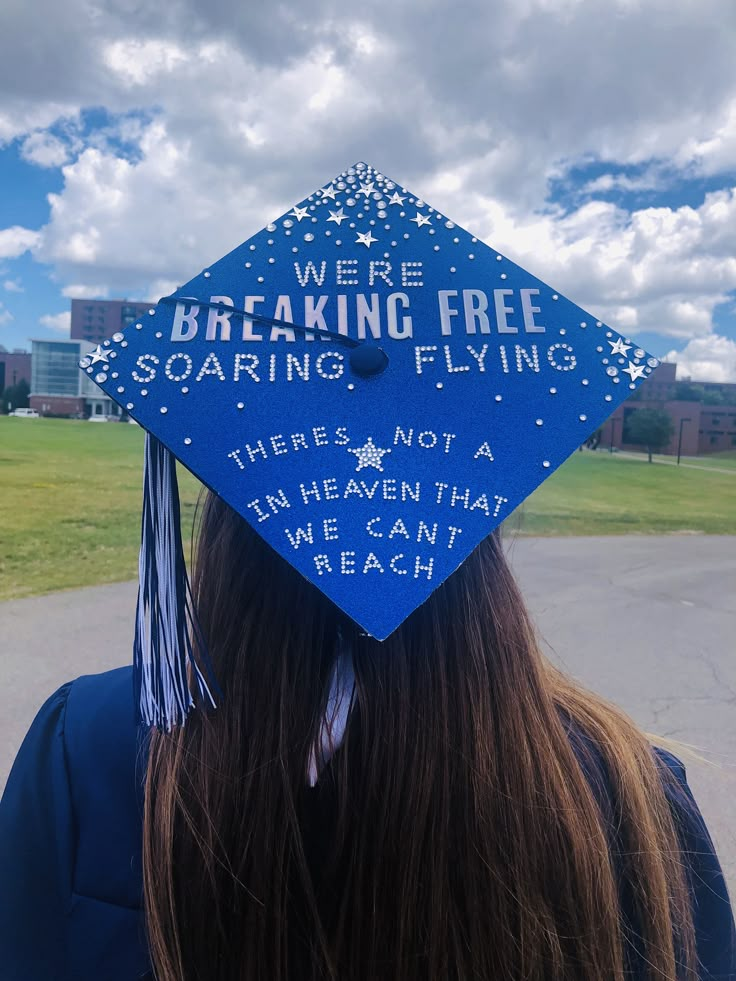 a blue graduation cap that says, we're breaking free soaring flying there is not a unleaen that we can't reach