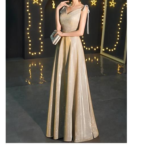 Gold V-neck Evening Dress With Sweep Train, Elegant Gold V-neck Evening Dress, Gold Ball Gown With Sweep Train, Gold Ball Gown Dress With Sweep Train, Gold Sleeveless Ball Gown For Party, Gold Sleeveless Evening Dress For Weddings, Gold Evening Gala Dress, Gold V-neck Evening Dress For Gala, Gold Sleeveless Gown For Banquet