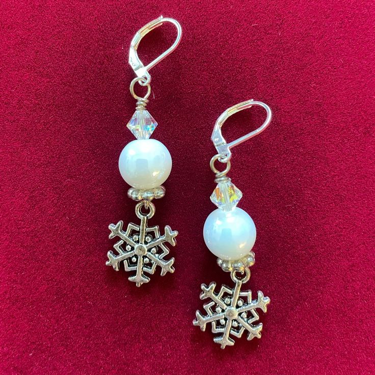 Silvertone Snowflakes Hang From White Glass Pearls That Have An Ab Swarovski Crystal Above It, Then Attached To Sterling Silver Lever Back Ear Wires. Adjustable Nickel-free White Crystal Earrings, Adjustable White Crystal Earrings For Gift, Elegant White Jewelry For Christmas, Elegant White Christmas Jewelry, Nickel-free White Crystal Earrings As Gift, White Christmas Jewelry With Ear Wire, White Dangle Christmas Jewelry, Nickel-free White Crystal Earrings For Gifts, White Nickel-free Crystal Earrings As Gift