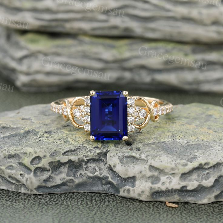 Lab Sapphire Engagement Ring Unique Yellow Gold Emerald Cut Blue Gemstone Bridal Ring Art Deco Promise Ring Anniversary Gift for Women Ring Specifications ➝Main Stone: Emerald Cut Lab Sapphire ➝Size: 6*8 mm ➝Side Stones: Moissanite or Diamond ➝Carats: 0.21ct ➝Band Width: 1.5mm ➝Band Thickness: 1.2mm All rings can be made of solid 10k/14k/18k rose gold, white gold, yellow gold. Need other gemstones or metal? please feel free to contact us. Ring Size All rings can be made into any size. If you hav Rectangular Lab-created Sapphire Rings, Royal Blue Sapphire Ring With Diamond For Gift, Blue Sapphire Ring With Gemstone Accents For Promise, Blue Sapphire Promise Ring With Gemstone Accents, Blue Birthstone Ring With Accent Stones And Lab-created Sapphire, Blue Rectangular Lab-created Sapphire Rings, Blue Sapphire Ring With Rectangular Stone, Blue Sapphire Crystal Ring With Accent Stones, Elegant Blue Birthstone Ring With Gemstone Accents