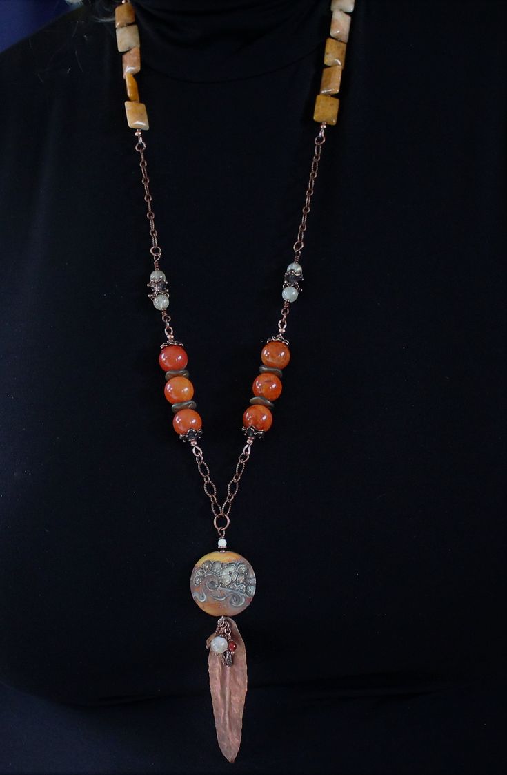 "A lovely combination of agate and quartz gemstones, antique copper chain, handmade copper components and clasp, and accented with my handmade lampwork glass beads, wire wrapped with a hand formed folded copper leaf, made by moi, and little gemstones. This super long, one of a kind lampwork necklace measures 33\" with a 5\" pendant and will arrive beautifully packaged. Sure to garner lots of compliments! To view more jewelry and handmade beads, click here... https://www.etsy.com/shop/StoneDesign Bohemian Wire Wrapped Czech Glass Beaded Necklace, Bohemian Wire Wrapped Beaded Necklaces With Czech Glass, Bohemian Czech Glass Beaded Necklace With Wire Wrap, Bohemian Czech Glass Wire Wrapped Beaded Necklace, Artisan Wire Wrapped Czech Glass Necklaces, Artisan Czech Glass Wire Wrapped Necklaces, Artisan Wire Wrapped Czech Glass Necklace, Bohemian Agate Beaded Chain Necklace, Bohemian Beaded Chain Copper Necklaces