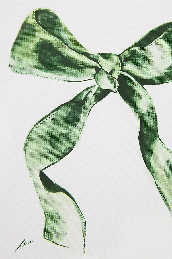 a drawing of a green bow on white paper