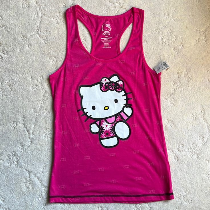 Kids Size Large 60% Cotton, 40% Polyester Pink Graphic Print Top For Sleepover, Casual Hello Kitty Print Tops For Sleepover, Playful Pink Cotton Tank Top, Pink Sleeveless Kawaii Top, Pink Sleeveless School Top, Pink Casual Tops For Sleepover, Sleeveless Pink School Top, Sleeveless Pink Top For School, Hello Kitty Print Sleeveless Top For Spring