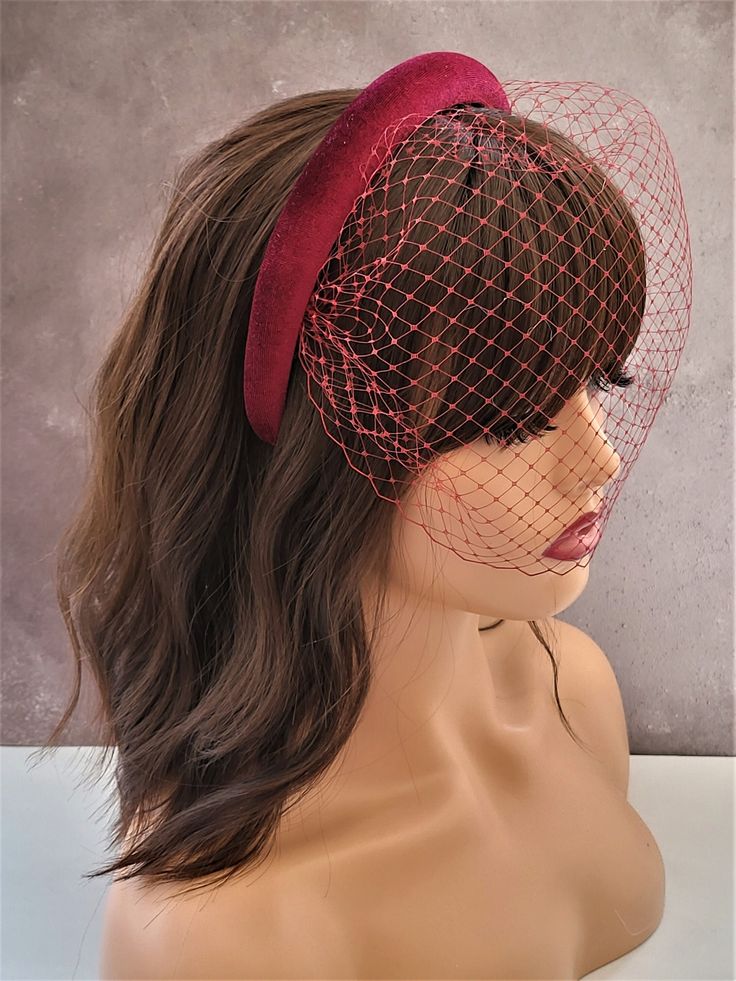 Presenting a beautiful burgundy/wine red velvet covered padded headband with an matching blusher veil, which is 2.5 cms in width at the widest part approximately and 1.5 cms in height, padded with a flattering rounded shape.  Perfect for special formal events.  If you would like the design customising at all, or an alternate colourway please get in touch with me and I will be delighted to help.  Please note the colour is slightly darker than it appears in the pictures. Follow us on Instagram: ht Red Wedding Hair Accessories With Matching Headband, Red Wedding Hair Accessories With Headband, Red Adjustable Hair Accessories For Wedding, Red Adjustable Vintage Mini Hats, Vintage Red Adjustable Mini Hats, Adjustable Red Headpiece For Wedding, Fitted Red Headband Headpiece, Elegant Red Adjustable Hair Accessories, Adjustable Red Wedding Headpiece