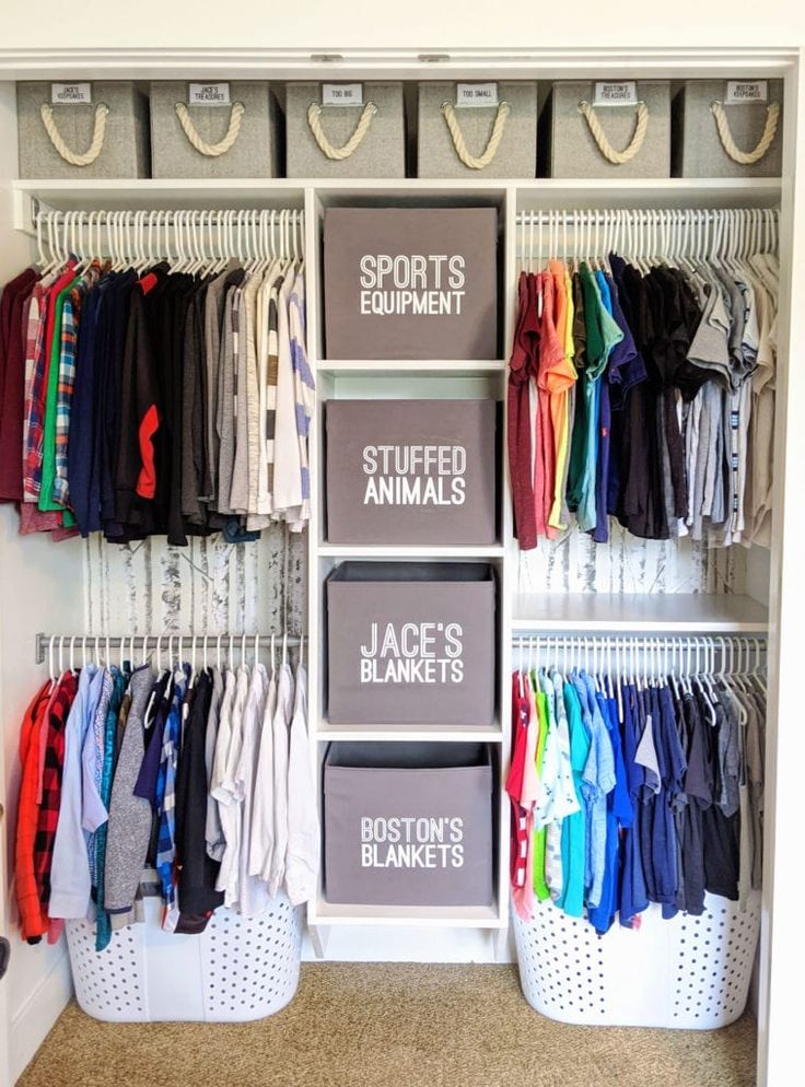 an organized closet with clothes and baskets