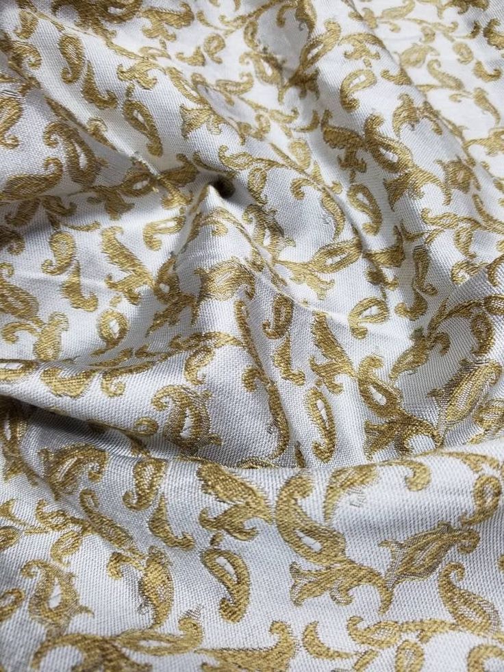 "Handcrafted beautiful brocade with mettallic thread soft fabric usable for apparel,accessories and interior designs. Reversible can be used both sides Beautifully made to use for costumes, dance wear, decorations, weddings and much more. Width : 45\" inches Color : beige gold Thank you for your coming! Please read policy before placing an order. Please contact us via ETSY Conversations for more details. Fabrics are sold by the yard. We will continue length of multiple yards . It will come in on Gold Brocade Fabric With Zari Work, Elegant Festive Jacquard Embroidered Fabric, Festive Elegant Jacquard Embroidered Fabric, Gold Embroidered Silk Fabric With Motifs, Gold Brocade Embroidered Fabric With Motifs, Elegant Gold Embroidered Raw Silk Fabric, Festive Gold Brocade Embroidered Fabric, Gold Embroidered Silk Fabric For Festivals, Gold Jacquard Fabric In Traditional Style