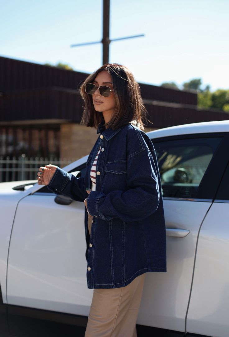 Crafted from luxuriously soft and comfortable dark denim, this Carrie Denim Jacket is sure to become your new favorite. The collared neckline and pocket details give the jacket a sophisticated look, while the button closures and relaxed fit provide comfort. Perfect for transitioning from summer to fall, you can layer it over any outfit for a trendy, elevated look. Perfect for errands, shopping, or a dinner out, this jacket is the perfect trend-setting piece. 100% Cotton Hand wash cold. Fall Dark Wash Denim Top With Pockets, Chic Fall Denim Top With Pockets, Chic Dark Wash Relaxed Fit Denim Jacket, Chic Dark Wash Denim Top With Pockets, Dark Wash Denim Top With Buttoned Pockets For Fall, Fall Dark Wash Denim Top With Buttoned Pockets, Chic Denim Blue Button-up Outerwear, Relaxed Fit Dark Wash Denim Jacket With Buttoned Pockets, Chic Dark Wash Denim Jacket For Day Out