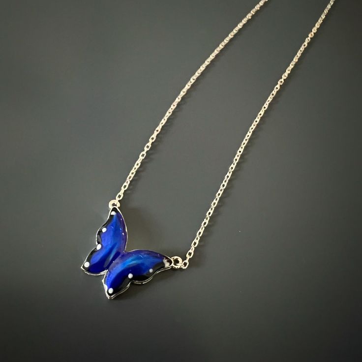 The Silver Spiritual Blue Enamel Butterfly Necklace, a captivating piece of jewelry that combines the beauty of sterling silver with the spiritual significance of a blue enamel butterfly pendant. Crafted with meticulous attention to detail, this necklace is designed to inspire a sense of spirituality, transformation, and inner growth. The butterfly, a symbol of transformation and rebirth, embodies the journey of the soul and serves as a reminder to embrace spiritual growth and embrace one's true Blue Enamel Pendant Jewelry, Blue Enamel Necklace With Polished Finish, Silver Enamel Jewelry With Adjustable Chain, Elegant Blue Butterfly Jewelry, Blue Enamel Jewelry With Polished Finish, Blue Butterfly Sterling Silver Jewelry, Blue Enamel Jewelry With Adjustable Chain, Nickel-free Blue Enamel Jewelry, Blue Sterling Silver Necklace With Polished Finish