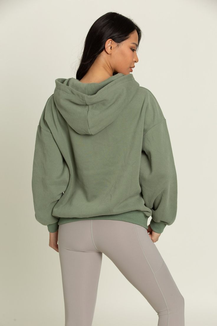 Our perfectly oversized Green GH Sport Hoodie Sweatshirt gives you the feeling of comfort and style in one staple hoodie. The dual side pockets give you an extra place to keep everyday essentials. Along with a hood to allow you to change your look to match wherever you're off to next. Cozy Fit Athleisure Hoodie For Loungewear, Fall Hoodie With Drawstring For Loungewear, Comfortable Hoodie With Adjustable Hood, Comfy Cotton Hooded Hoodie, Solid Color Comfy Hoodie For Loungewear, Fall Loungewear Hoodie With Drawstring Hood, Comfortable Loungewear Hoodie With Drawstring, Athleisure Hoodie With Drawstring Hood For Fall, Oversized Green Sporty Hoodie