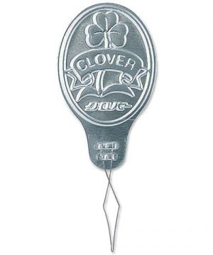 a metal sign that says clover bros above it is attached to a wire with a hook