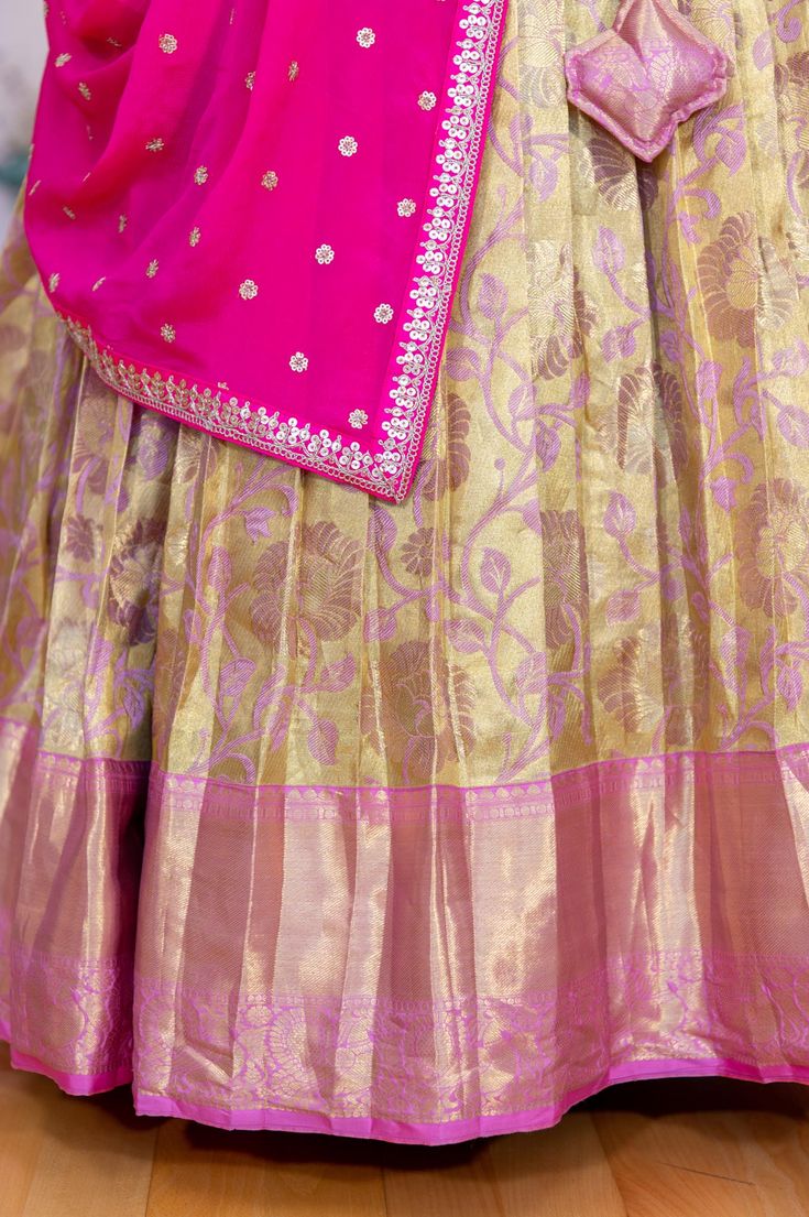 This elegant Gold and Light Pink Border Kanjivaram tissue silk Lehenga features an embroidered dupatta for a touch of sophistication. Perfect for any special occasion, this garment is sure to make an impression. Tissue Silk Lehenga, Silk Lehengas, Pink Border, Gift Card Exchange, Embroidered Dupatta, Gold And Pink, Silk Lehenga, Blouse Length, Blouse Fabric