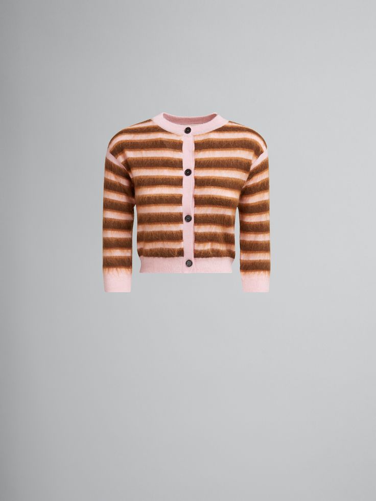 a brown and white striped sweater with buttons on the front, hanging from a hook