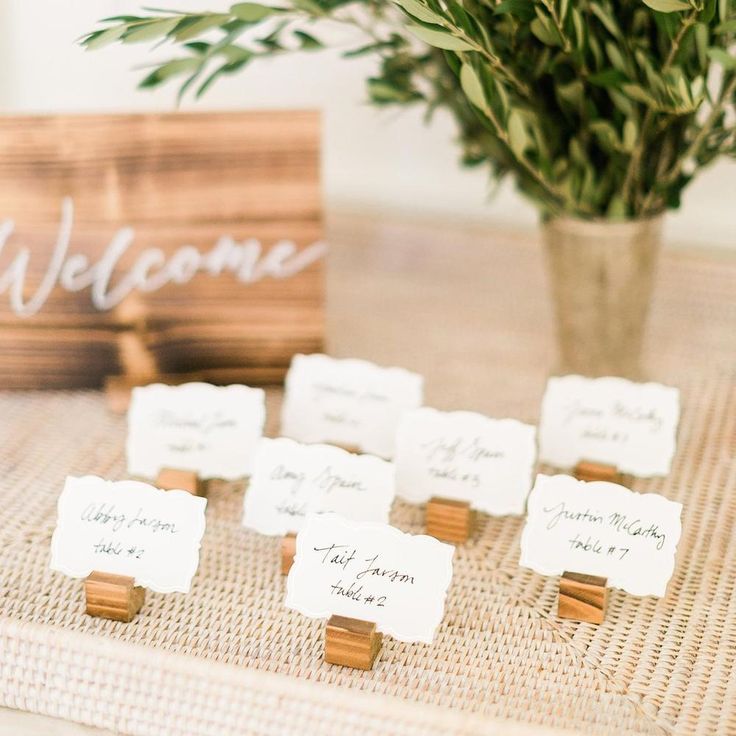 there is a table with place cards on it