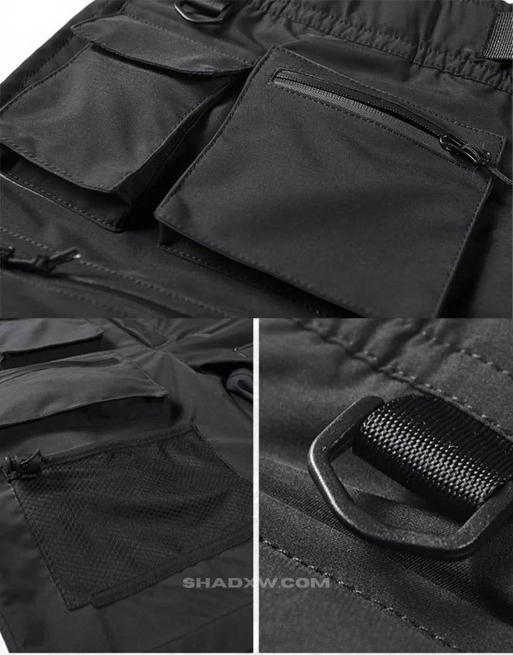 Design: Techwear, Ninja Techwear, Cyberpunk, Military, Futuristic Materials: Polyester Fit type: Regular Closure type: Elastic waist Suitable for men and women Machine washable: 30 °C (86 °F) FREE worldwide shipping Size(cm) Waist (cm) Hip Length S 72 103 48 M 82 107 49 L 86 111 51 XL 90 115 52 2XL 94 119 53 Black Functional shorts Keep a techwear style even in summer with these tactical shorts. Made from breathable materials, they are guaranteed to provide maximum comfort during the summer whil Nylon Techwear Shorts For Outdoor, Outdoor Nylon Techwear Shorts, Outdoor Techwear Nylon Shorts, Techwear Shorts With Pockets For Outdoor, Black Nylon Techwear Shorts, Hiking Techwear Shorts With Multiple Pockets, Techwear Shorts With Multiple Pockets For Outdoor, Black Nylon Utility Shorts, Nylon Techwear Shorts For Streetwear