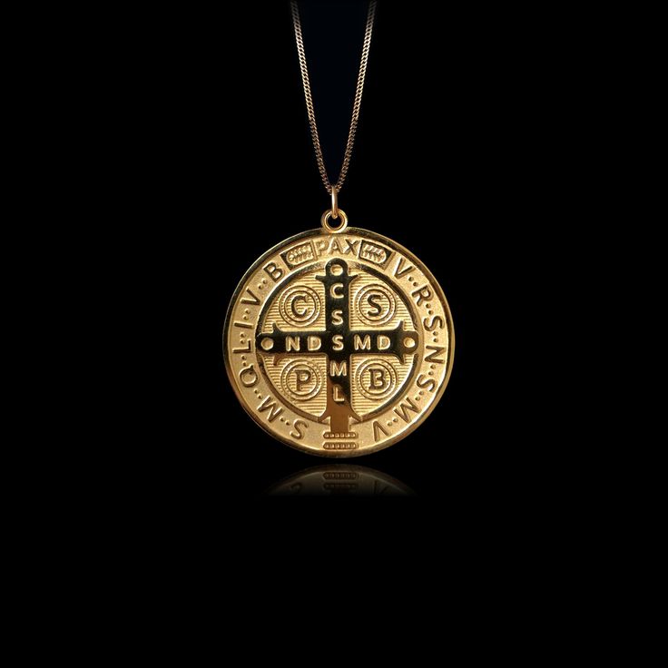 Elevate your faith with our 14k Gold Saint Benedict Pendant. This solid gold necklace showcases exquisite craftsmanship, symbolizing protection and devotion in the Catholic faith. Explore our Saint Benedict-themed jewelry collection, perfect for those seeking a unique piece inspired by Catholic traditions. PENDANT INFORMATIONThis pendant is made of real, solid gold.• Made in USA• Material: 14k or 18k solid gold• Finish: polished• Height: 1.15" (29 mm) | *includes the small circle, bail dimension Spiritual Ceremonial Jewelry That Is Tarnish Resistant, Spiritual Ceremonial Tarnish-resistant Jewelry, Sterling Silver Medallion For Blessing Occasion, Commemoration Necklace With Large Round Pendant, Spiritual Sterling Silver Medallion Necklace Tarnish Resistant, Spiritual Yellow Gold Medallion Necklace With Large Pendant, Spiritual Sterling Silver Medallion Necklace, Tarnish Resistant, Symbolic Tarnish Resistant Medallion Necklace, Spiritual White Gold Jewelry With Large Pendant